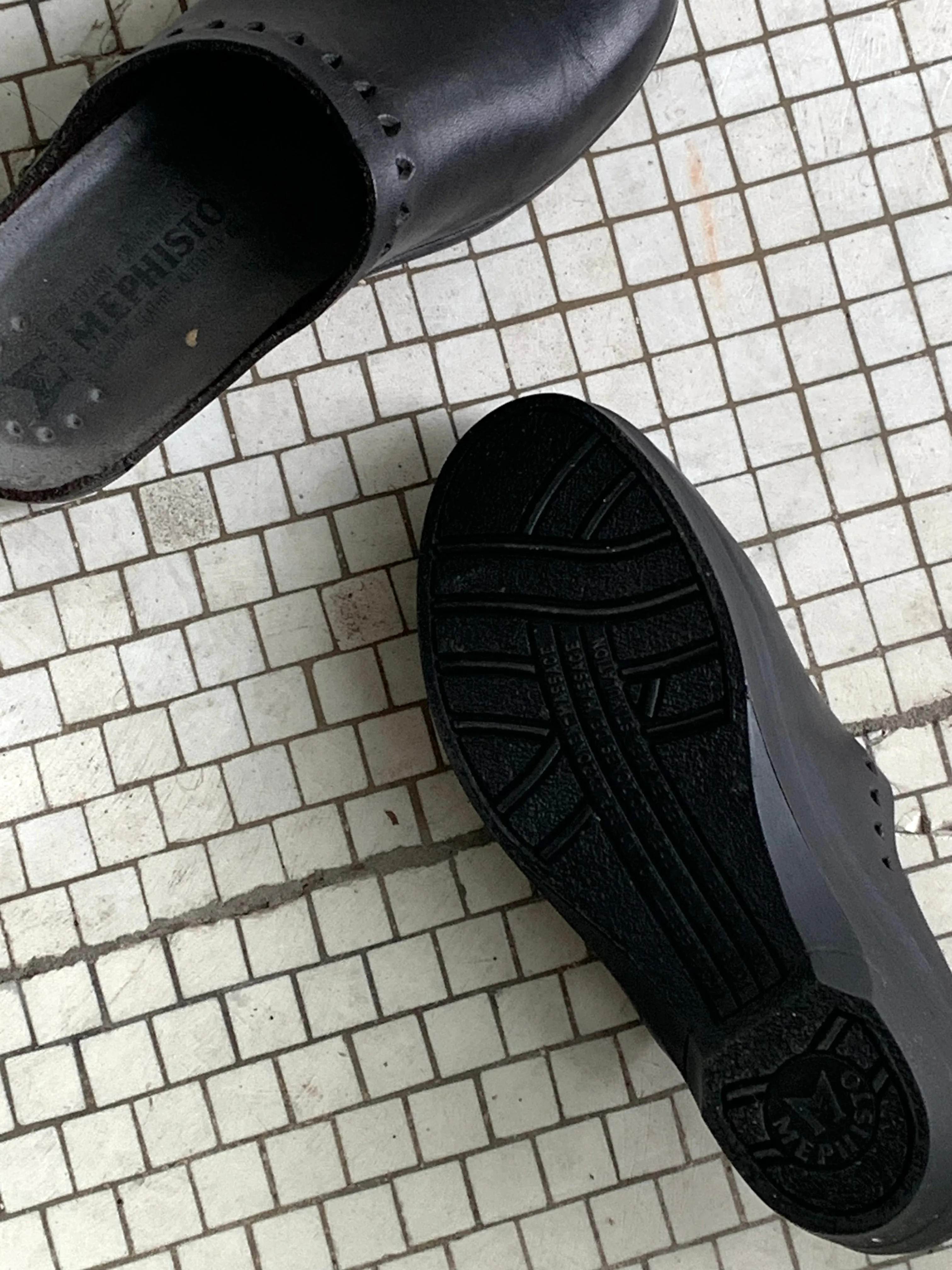 Black leather clogs