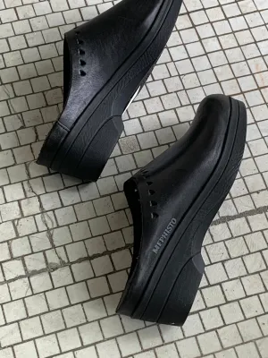 Black leather clogs