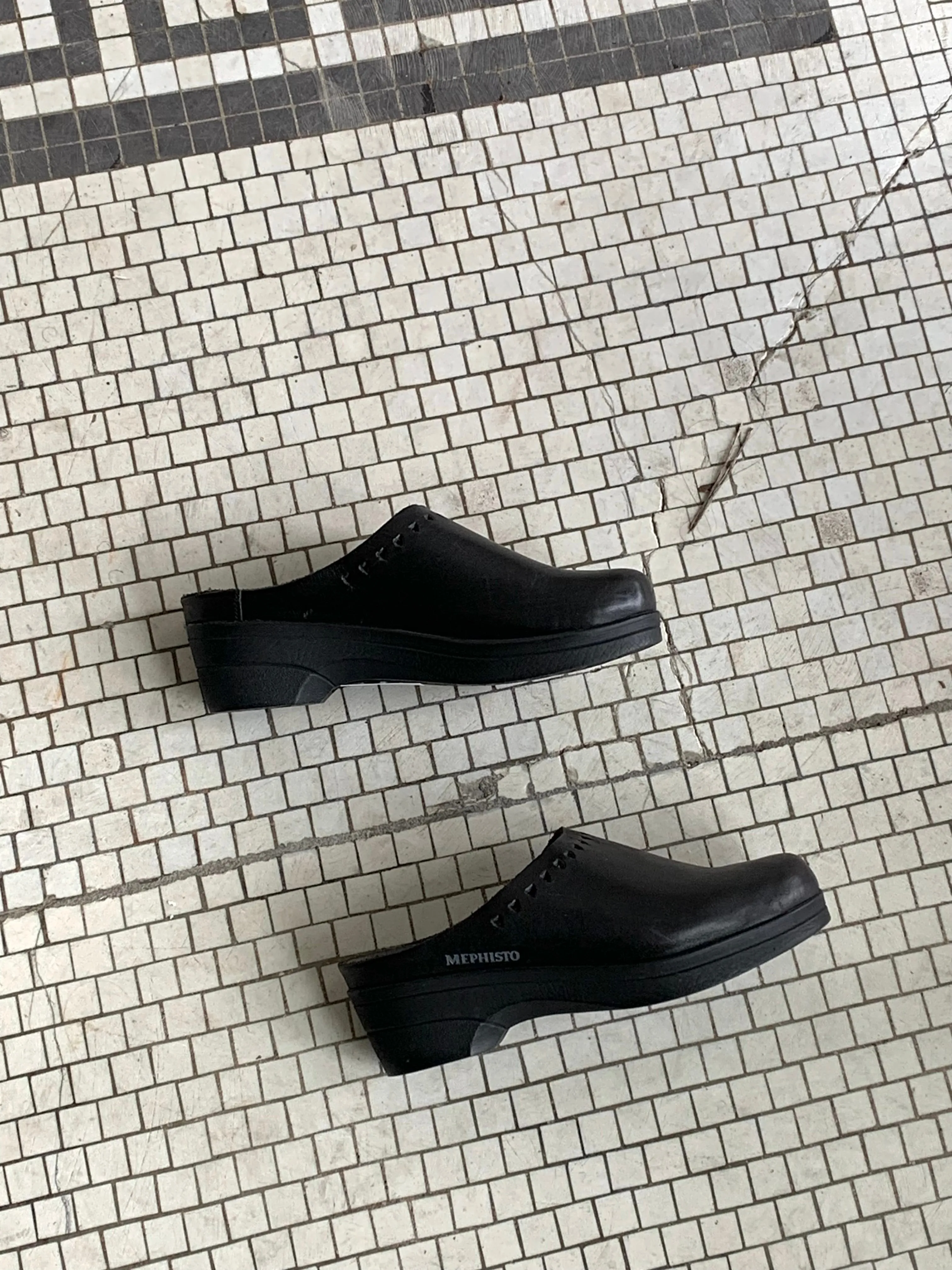 Black leather clogs
